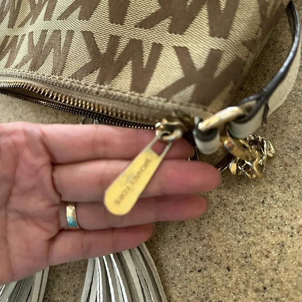 Michael Kors Monogram Drawstring Bucket Brown Mini WithTassel Crossbody Bag